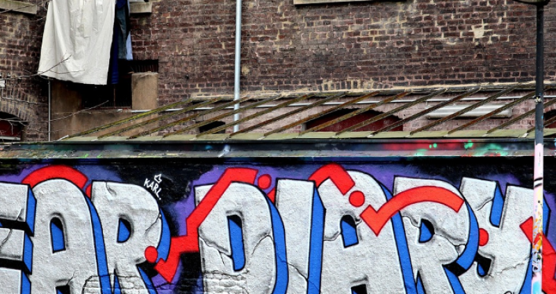 Jongeren van VNJ Belsele spuiten graffiti op legale muur